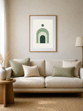 Sage Arches abstract poster in a light frame above a sofa in a bright living room