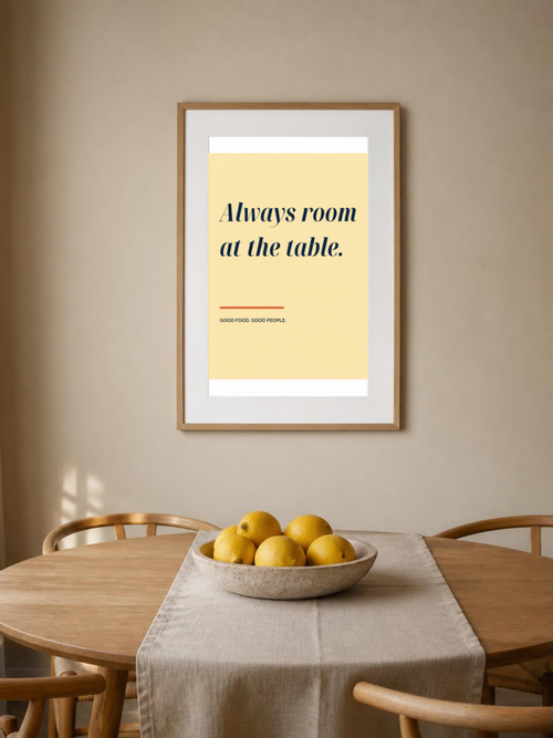Always Room at the Table poster in a frame above a dining table – room mockup