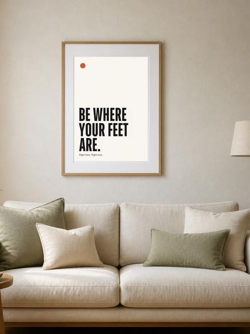 Be Where Your Feet Are poster in a frame above a sofa – room mockup