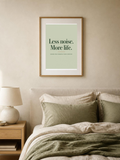 Less Noise poster in a frame above a bed – room mockup