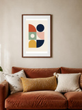 Color Blocks poster in a frame above a terracotta sofa – room mockup