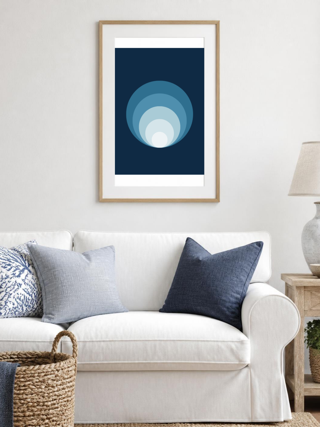 Ocean Rings poster in a frame above a white sofa – room mockup