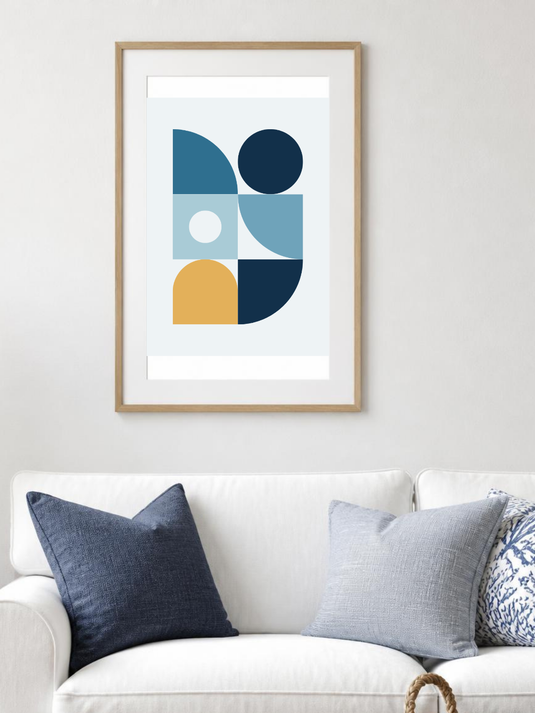 Ocean Blocks poster in a frame above a white sofa – room mockup