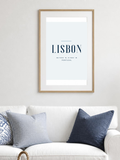 Lisbon poster in a frame above a white sofa – room mockup