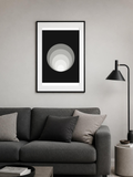 Mono Rings poster in a frame above a grey sofa – room mockup