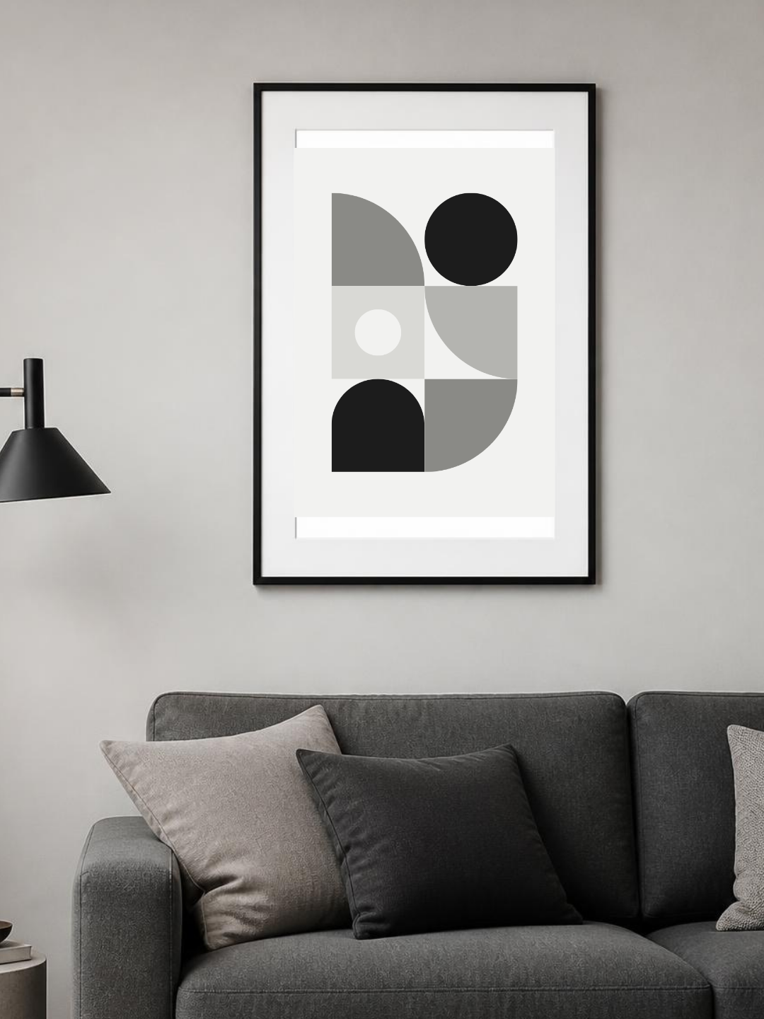 Mono Blocks poster in a frame above a grey sofa – room mockup